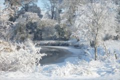 a local river here in the UK painted with snow and frost